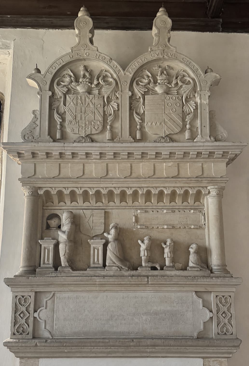 Full-height carved stone chancel monument inside All Saints Little Bradley.